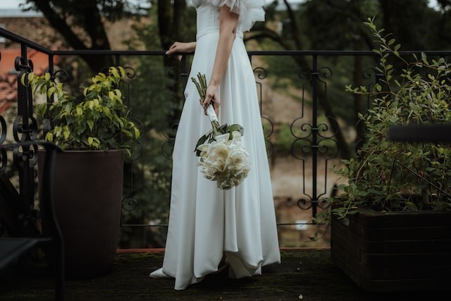 person with wedding bouquet